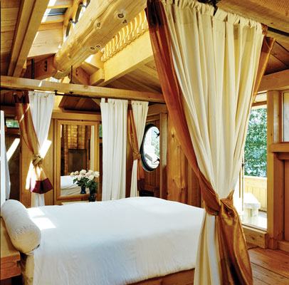The master bedroom is tucked upstairs, with a fireplace and an awe-inspiring view of the bay.